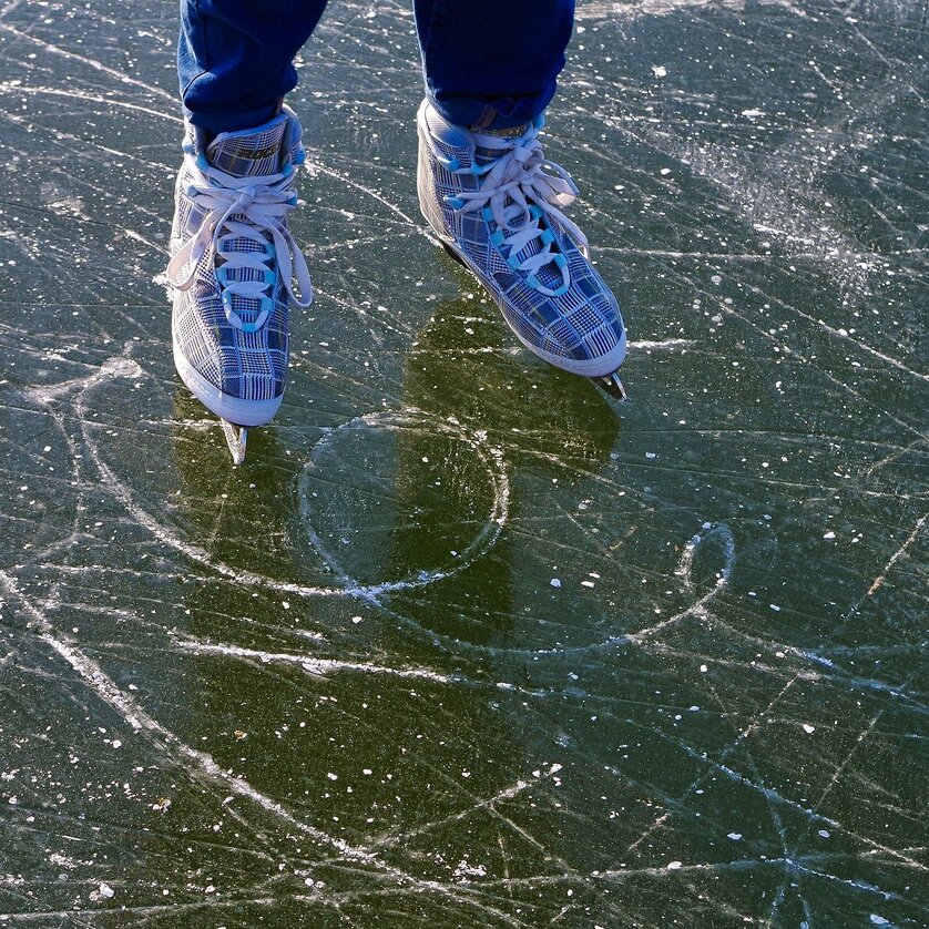 Ice Skating on Natural Ice | © Pixabay Person in ice skates on frozen lake with scratch marks. | © Pixabay