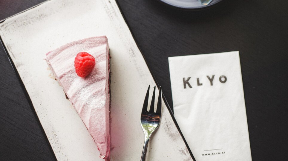 A slice of raspberry tart with a cup of coffee in the KLYO restaurant. | © Aaron Jiang