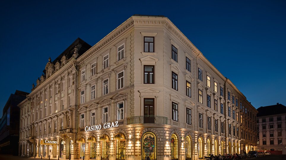 Casino Graz, an elegant building illuminated at dusk. | © Casino Graz