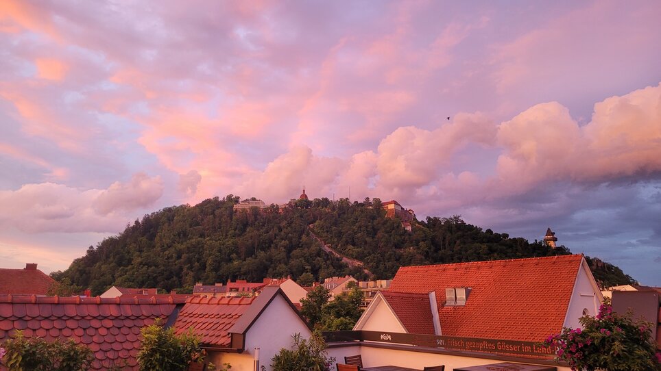 View of Graz at sunset with clouds. | © Gasthof Lend-Platzl