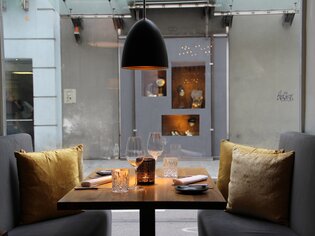 Cozy restaurant table with candlelight and elegant atmosphere.
