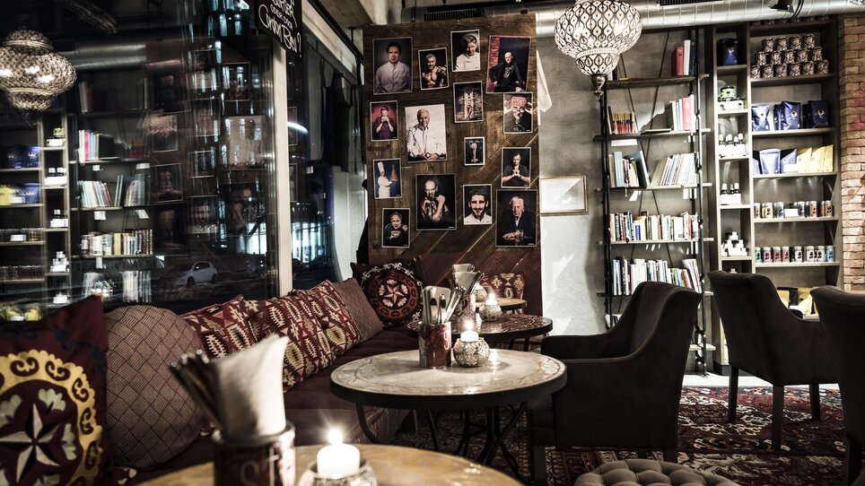Cozy café with pictures on the wall and stylish furniture.