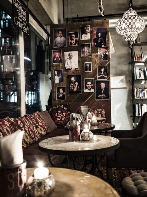 Cozy café with pictures on the wall and stylish furniture.