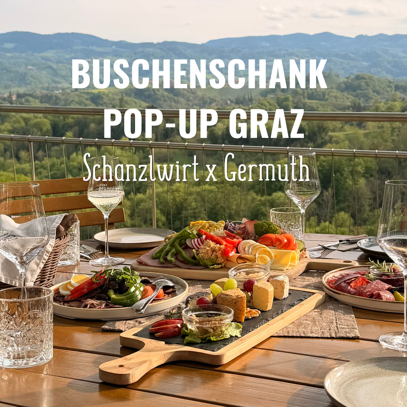 Tavolo con cibo e bevande, vista su Graz. | © Schanzlwirt