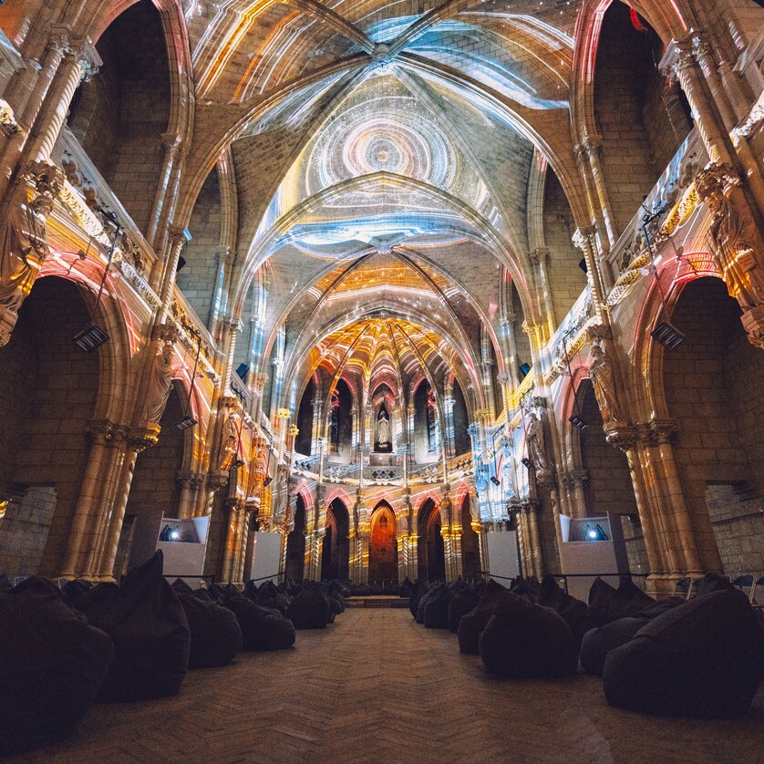 View inside an old church with light projections. | © Projektil