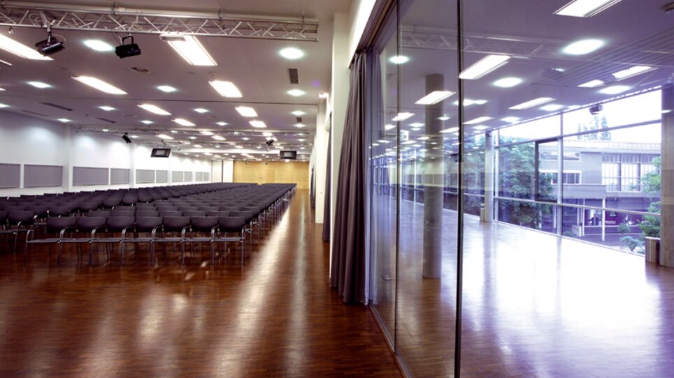 Large conference room with seating for an event. | © MCG