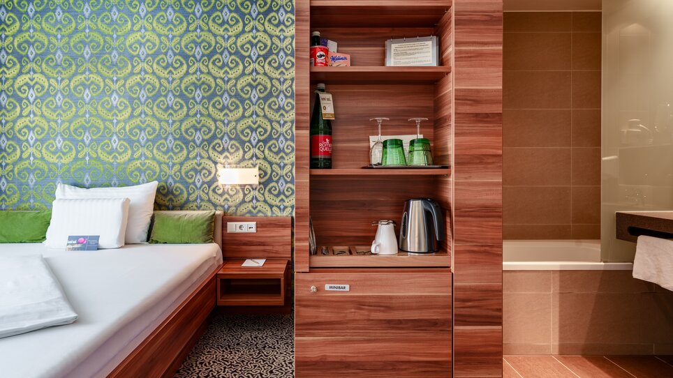 Room in Hotel Süd featuring beds and bathroom. | © Hotel Süd