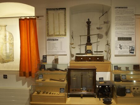 View of the Theriak Museum featuring historical showcases and information walls. | © Theriak Museum