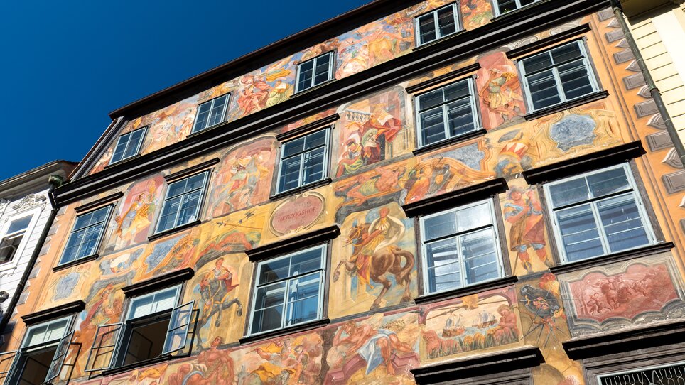 Fassade des Gemalten Hauses in Graz mit bunten Fresken. | © Graz Tourismus - Harry Schiffer
