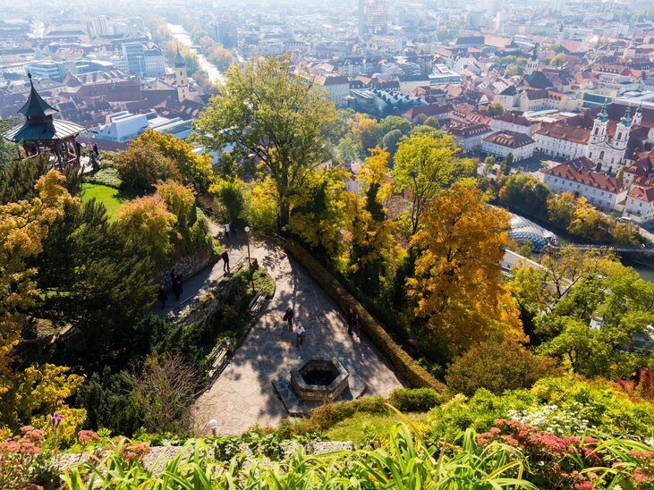 View of Graz with the Turkish Well on the Schlossberg and the Mur. | © Graz Tourismus - Harry Schiffer
