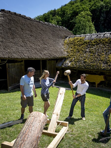 Group activity in Open-Air Museum Stubing involving woodworking. | © Region Graz - Tom Lamm