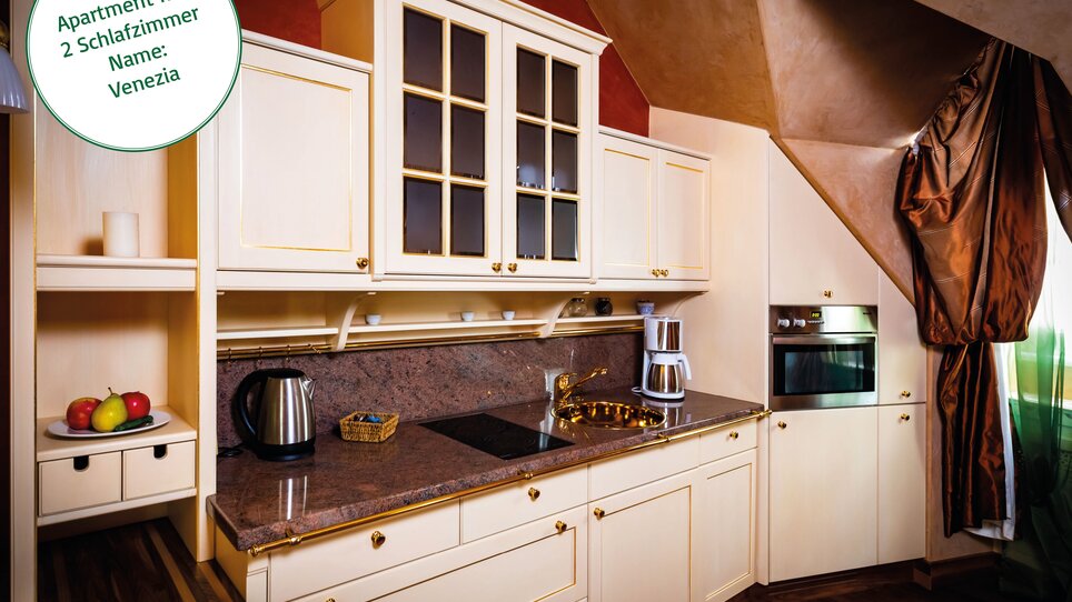 Area cucina dell'appartamento con fornitura di legno  | © Grossauer Tourismus