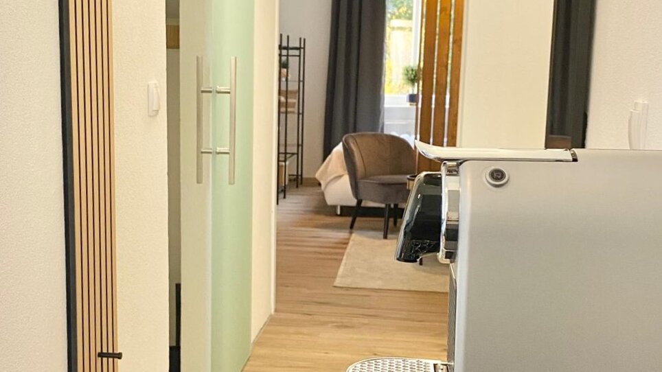 Modern interior view with coffee machine. | © CityStage Studio