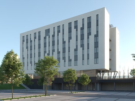 Facade of the TT-Rooms Apartment-Hotel with parking lot and trees. | © Tomo-Tec Immo GmbH