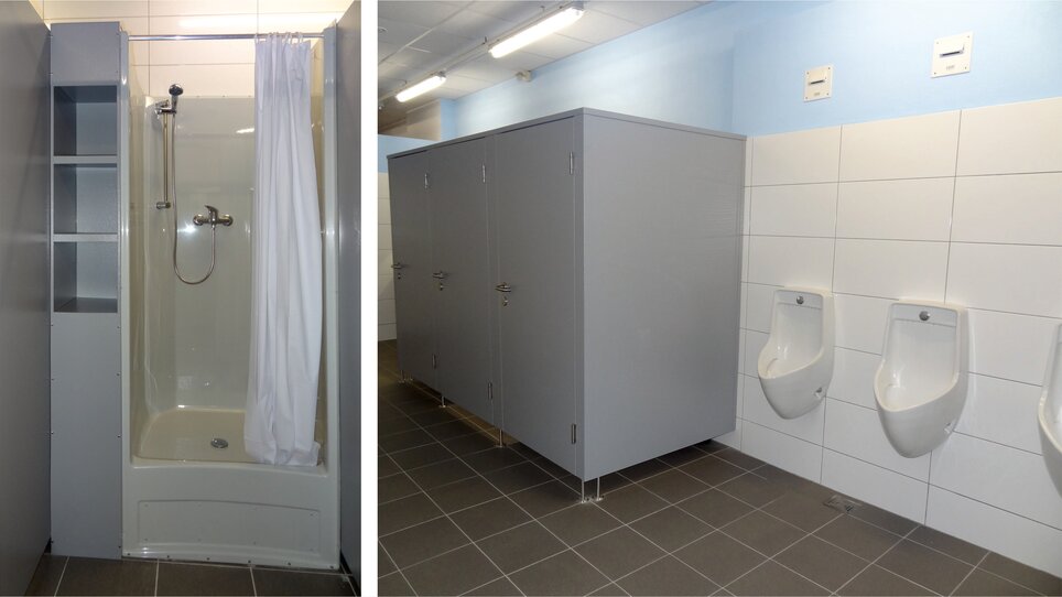 Shower and toilet facility with urinals in a restroom | © Alfred Chyba